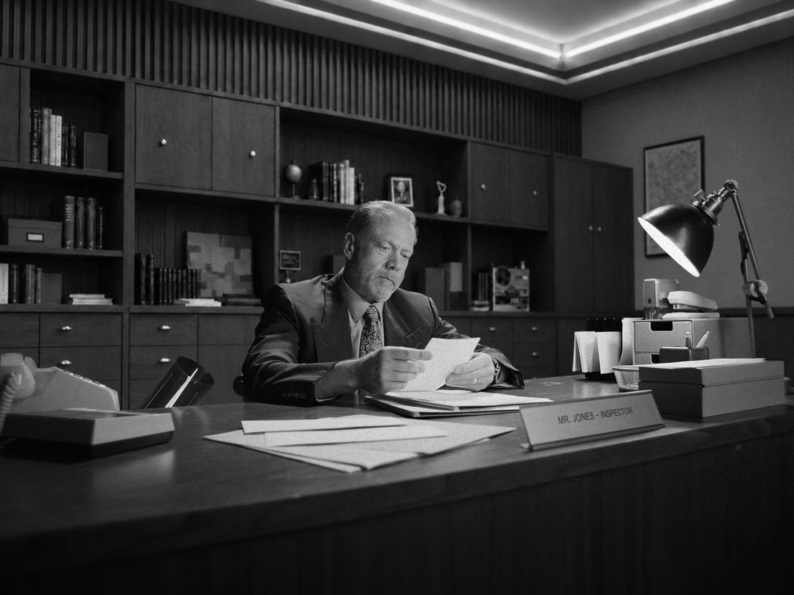 Greptile AI — Inspector at his desk