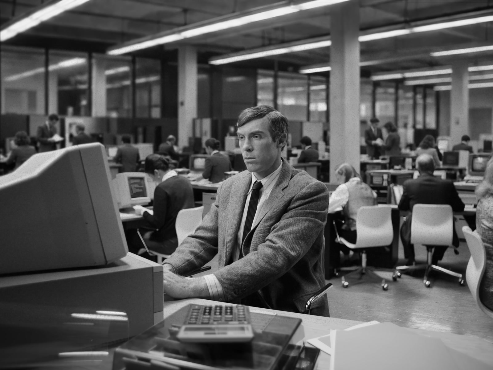Greptile AI — Office worker at his computer