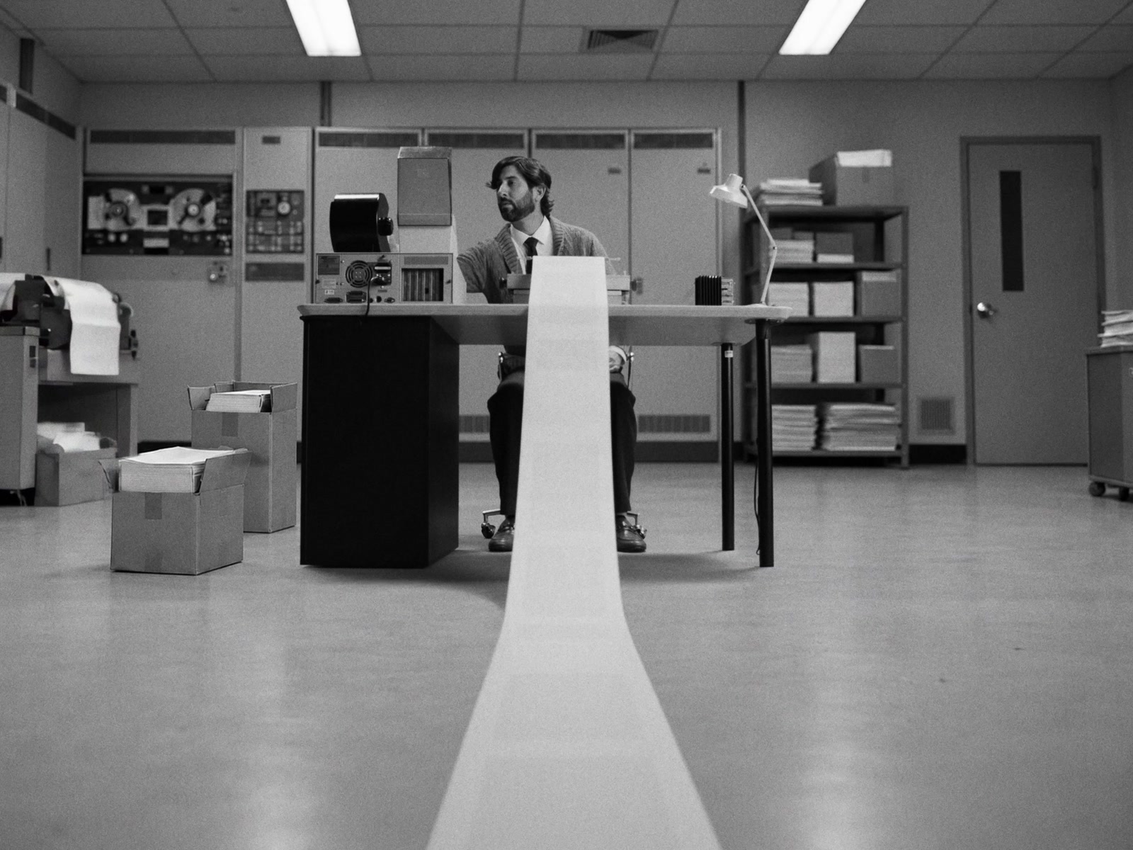 Greptile AI — Paper stretching from the machine