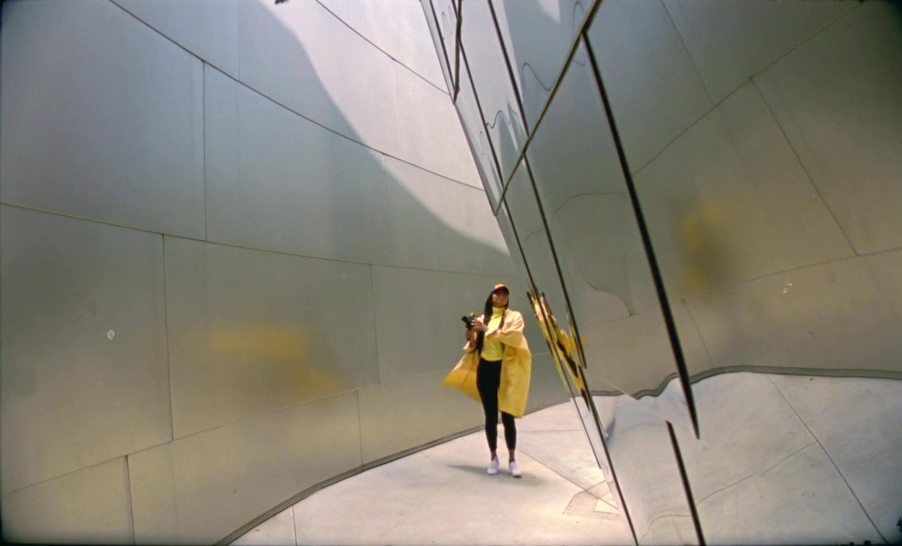 Planetarium — Photographer beside reflective architecture